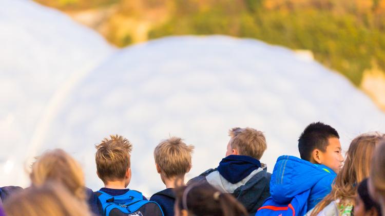 School group looking at the Eden Project Biomes