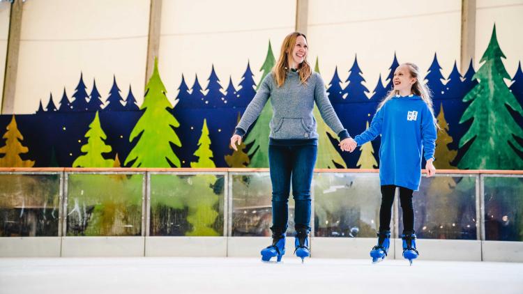 Mum and daughter ice skating