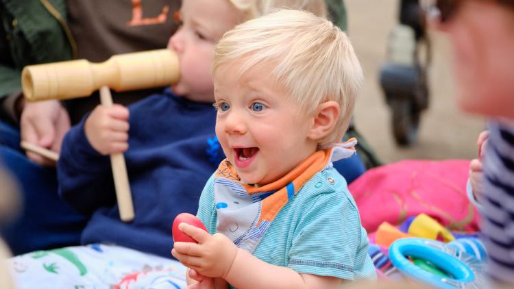 Mum and baby singing and socialising in Med Biome.
