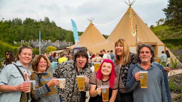 Group at Eden Sessions posing with drinks