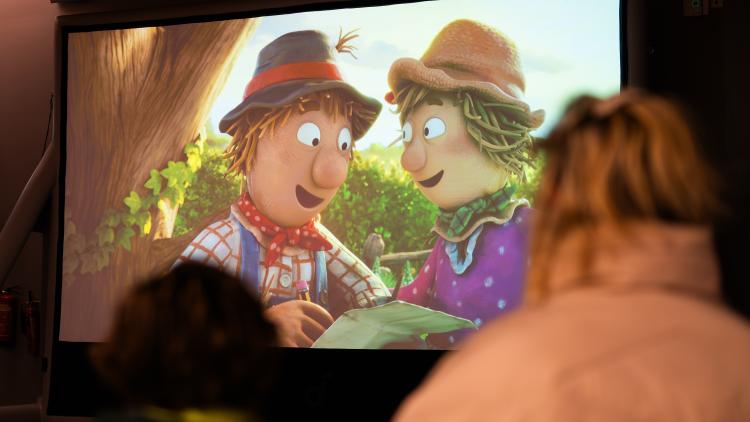 The Scarecrows' Wedding TV programme showing on large screen