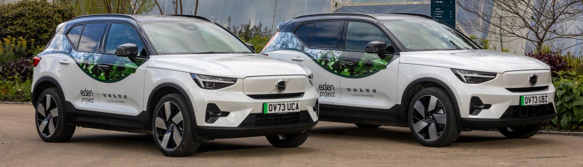 Electric Volvo cars parked outside the Eden Project's Biomes
