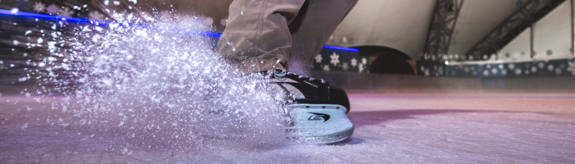 Ice skater skidding on the ice