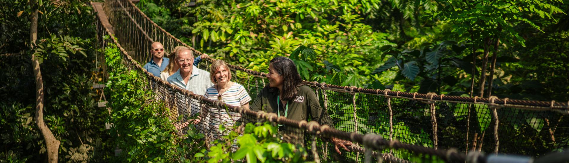 Tour walking across a wobbly bridge