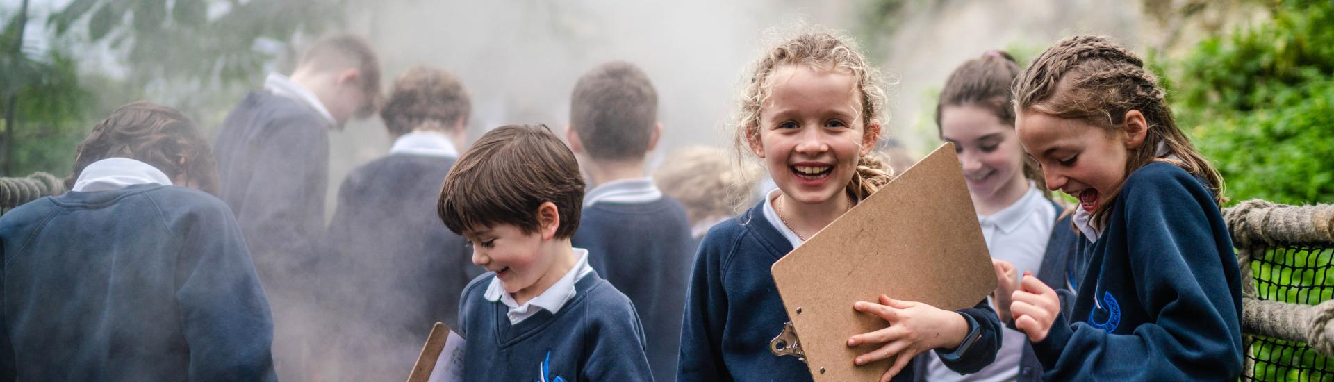 School children on the cloud bridge in the Rainforest Biome.